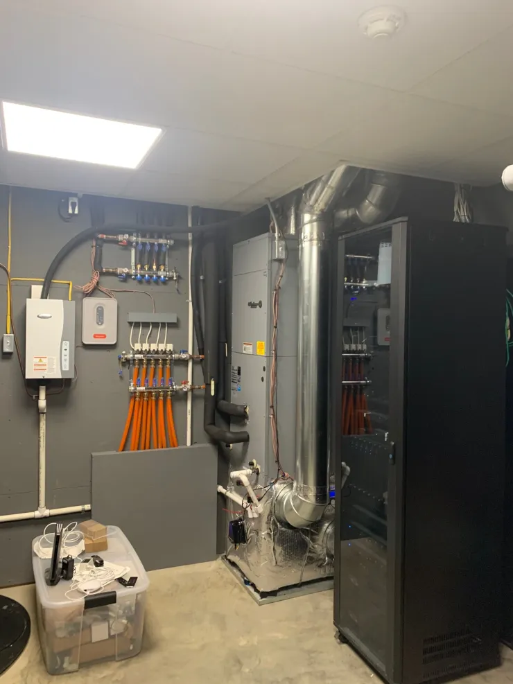 Mechanical room with radiant manifolds and ductwork